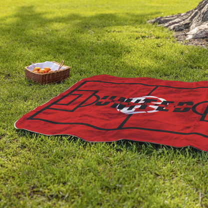 Key_West_United_Stadium_Blanket_StadiumBlanket_Lifestyle_Grass_H_Mockup.png