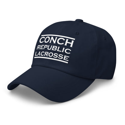 Navy blue cap with 'Conch Republic Lacrosse' text on a white background